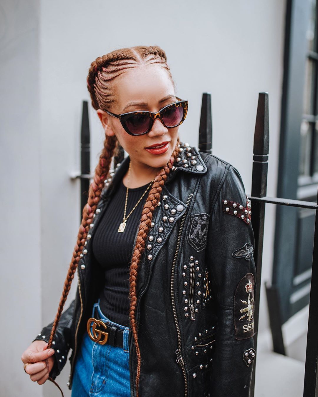 Woman with long pigtail cornrows with extensions