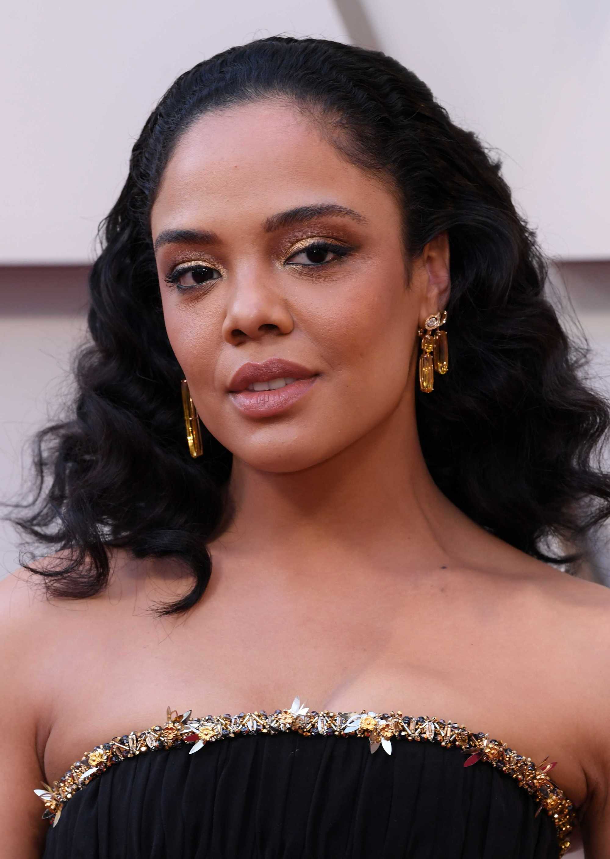 Tessa Thompson with dark swept back curls