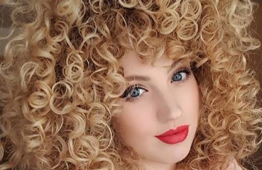 Woman with curly blonde hair
