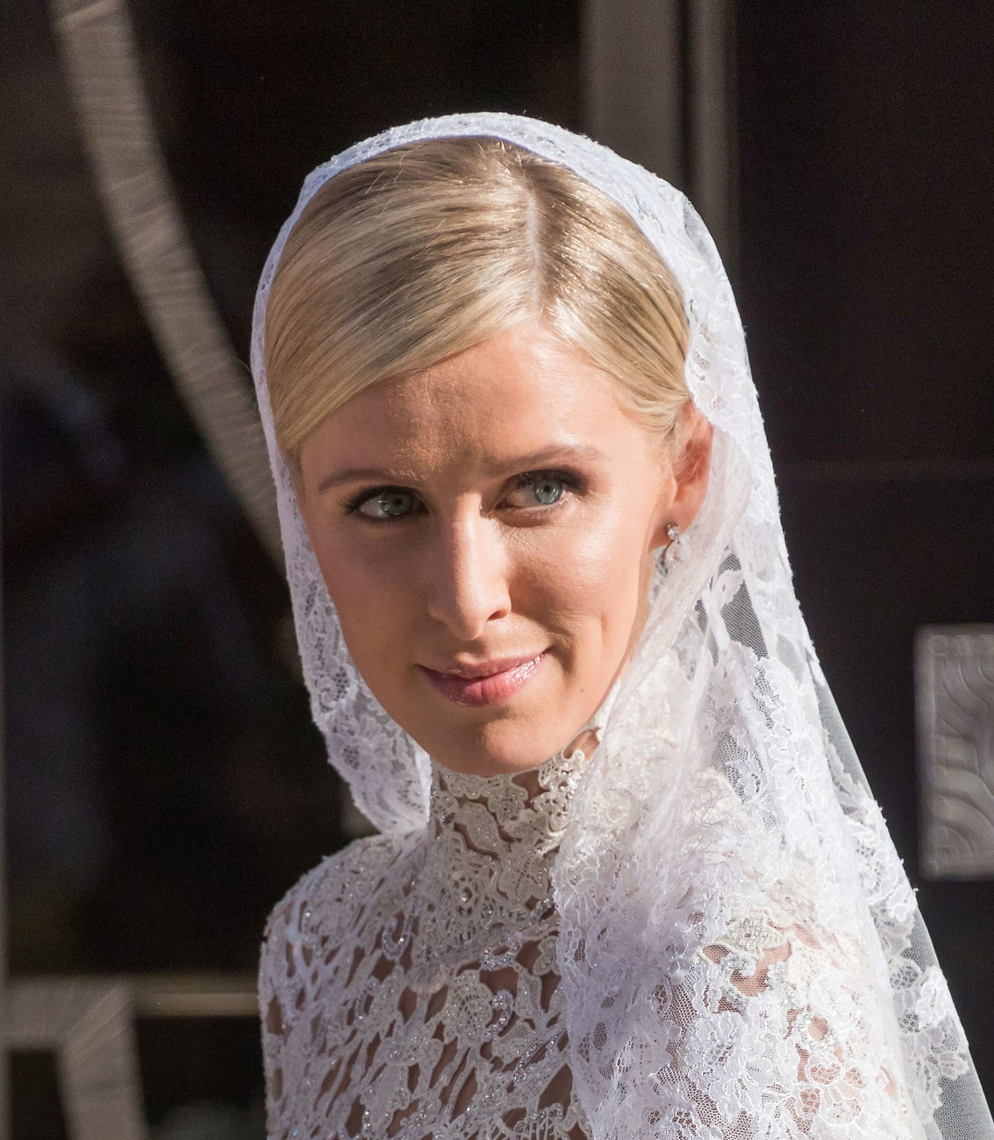 Nicky Hilton with sleek side part golden blonde hair
