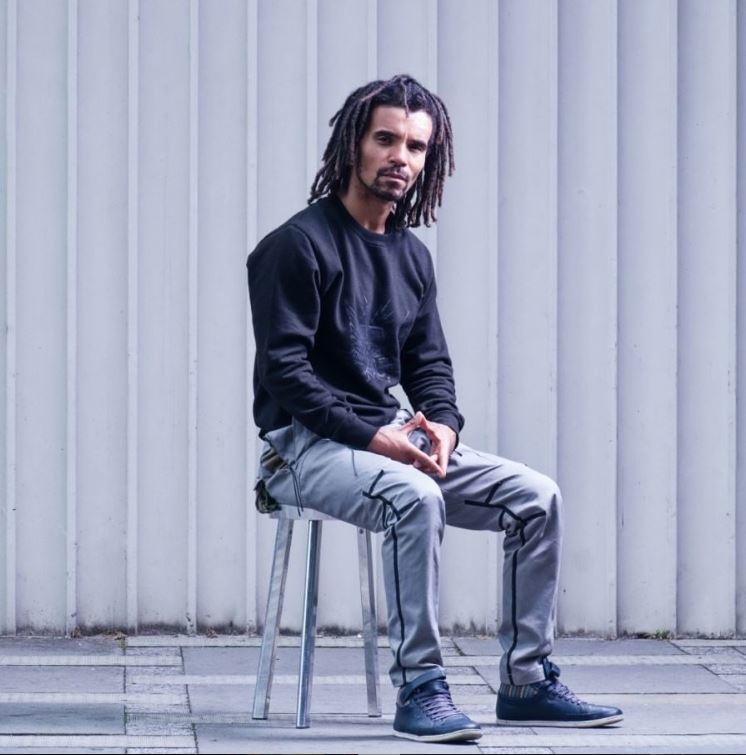 Akala with shoulder length dreadlocs twists