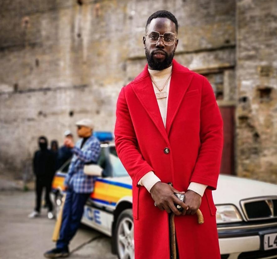 Ghetts with high tapper fade haircut with long beard