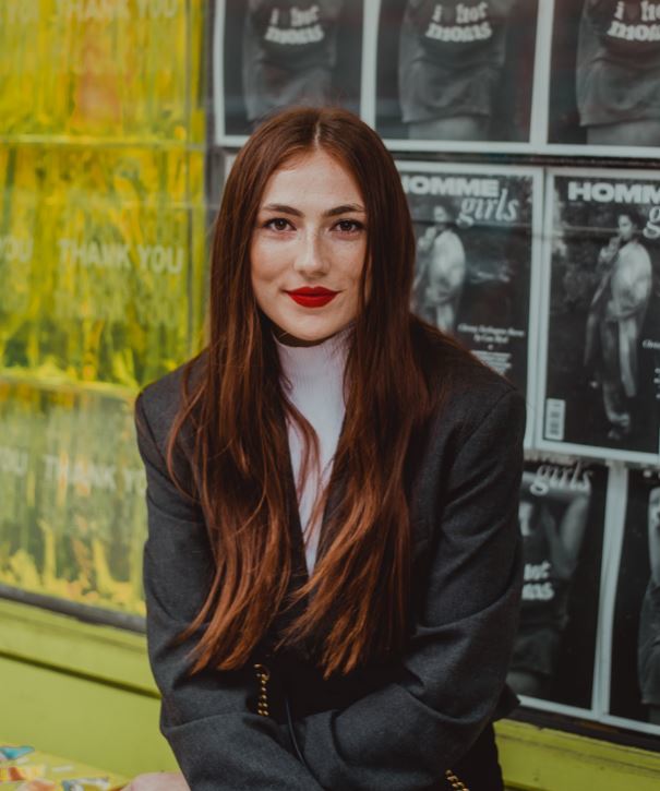 Pretty brunette with long hair and red lipstick