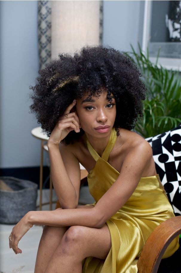 young black woman with large curly afro hair
