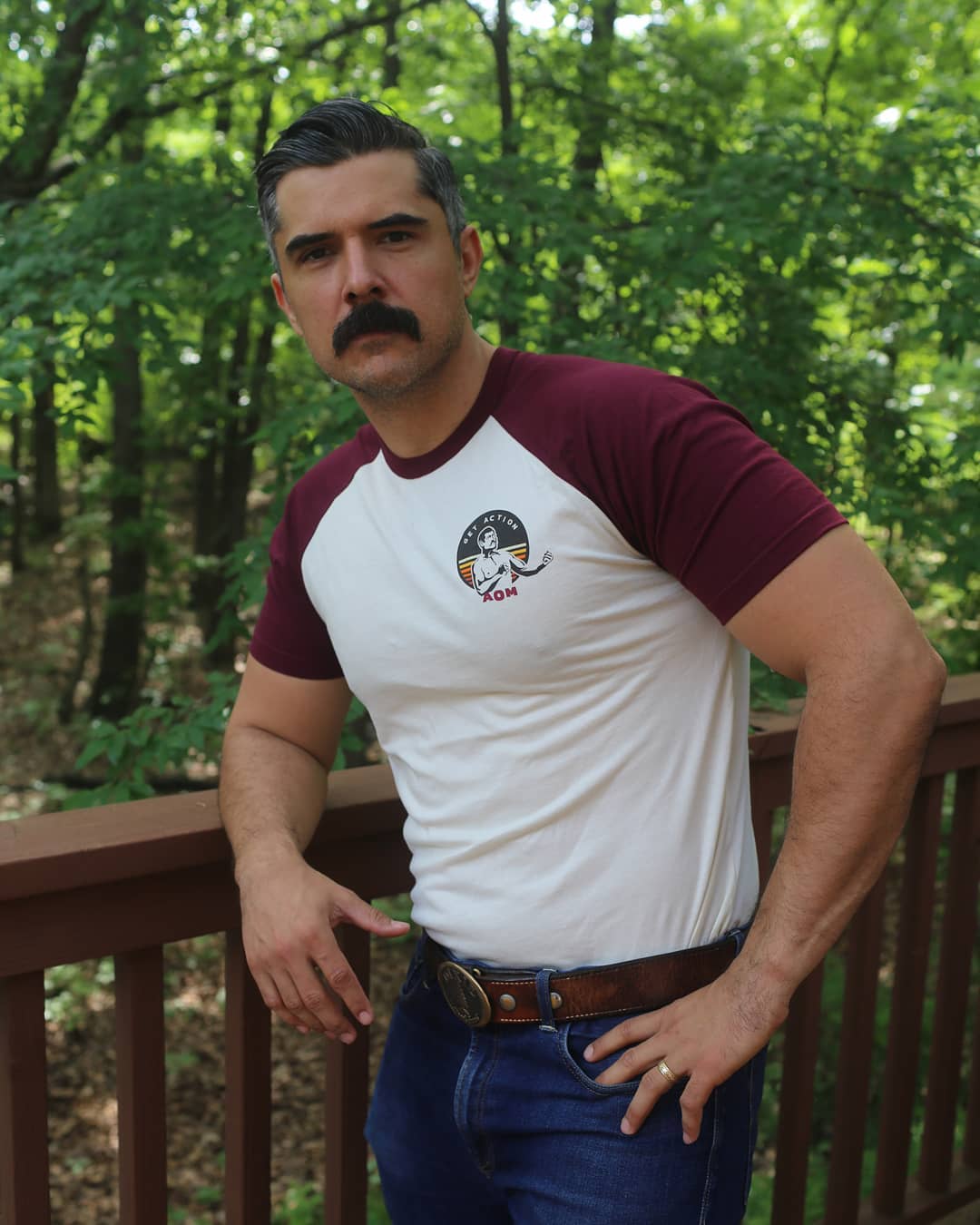 Man with dark short hair and mustache