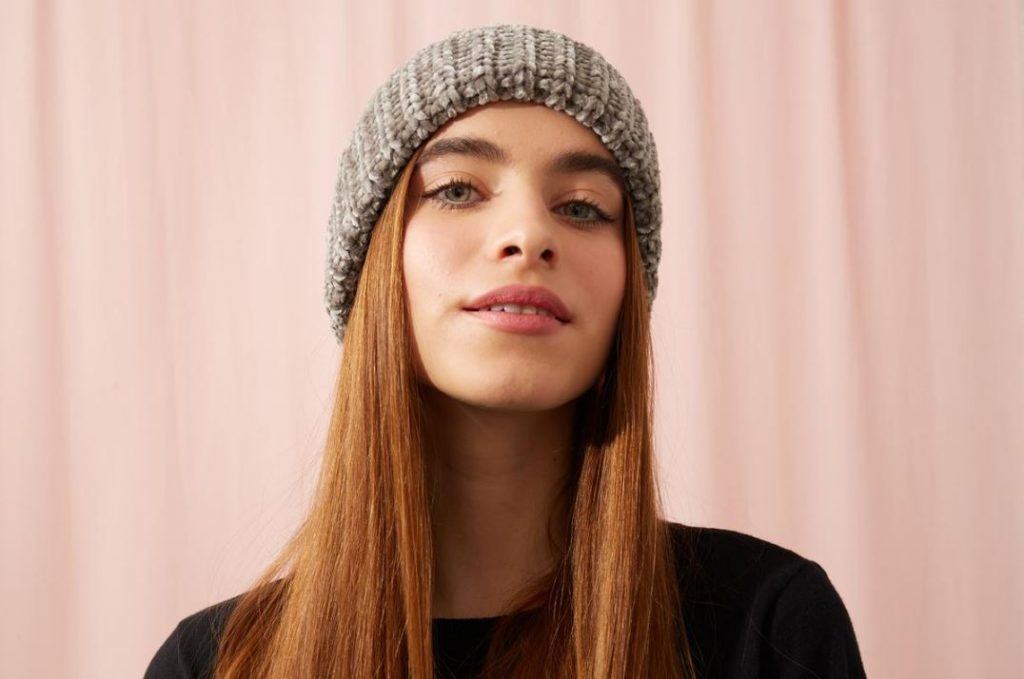 Young woman with beanie hat and long hair