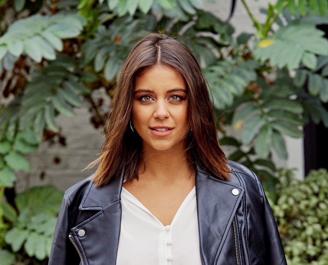 Young brunette with a long bob and leather jacket