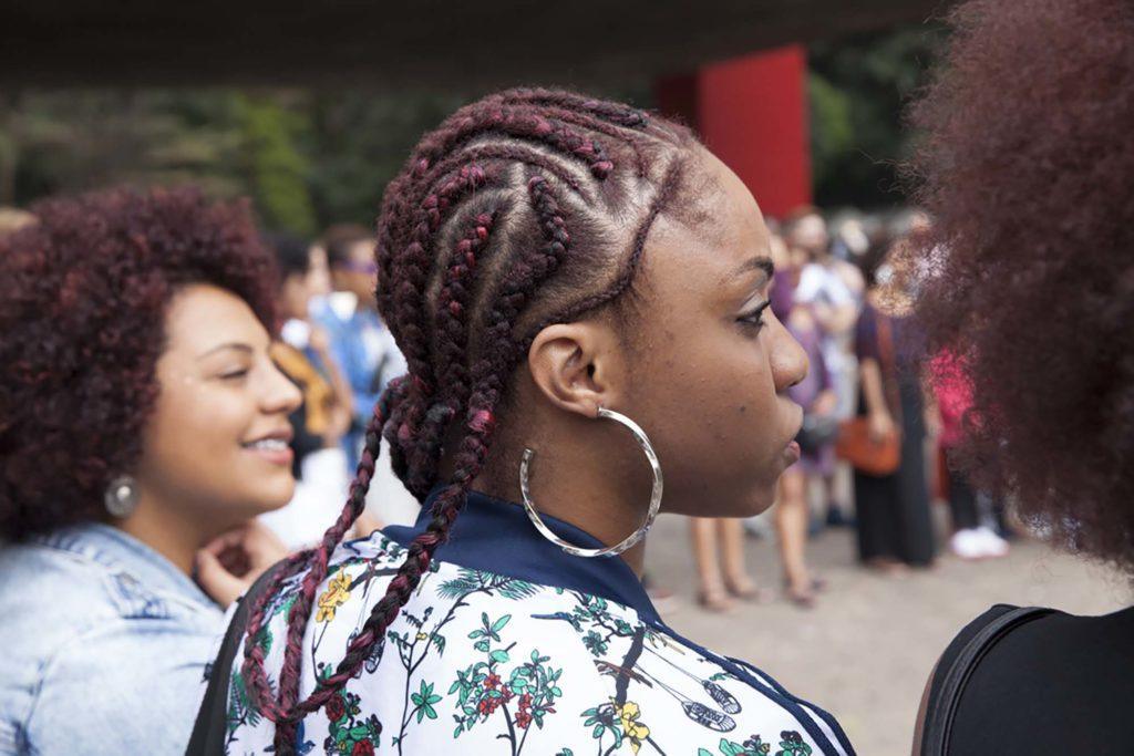 Woman with red hair in cornrows