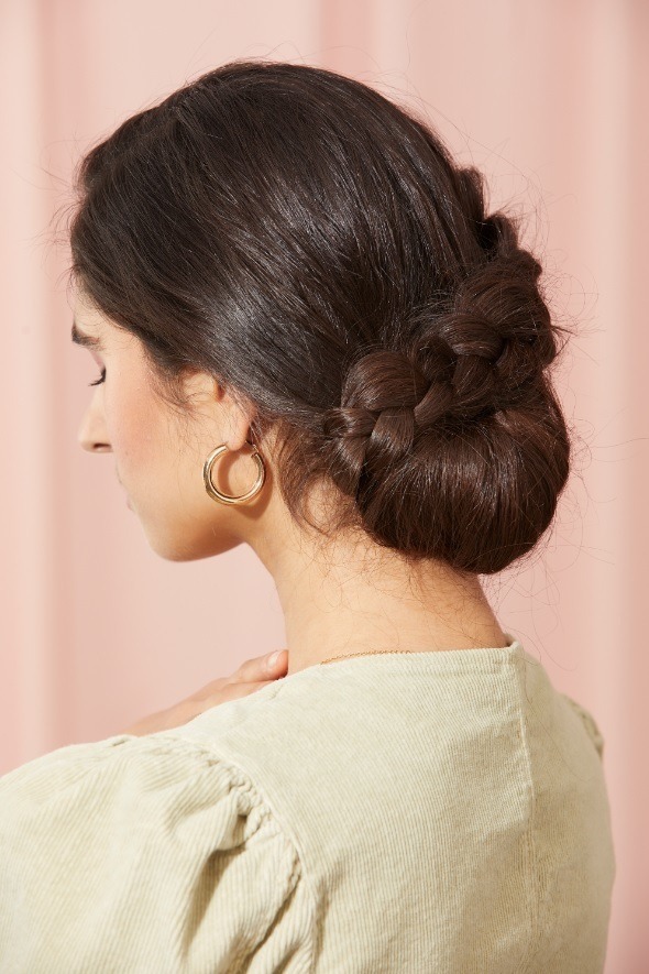 Brunette with a low wrap around braided bun