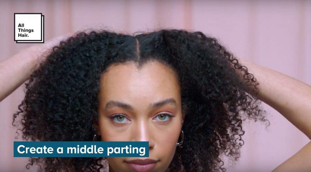 Woman with natural hair in a middle parting