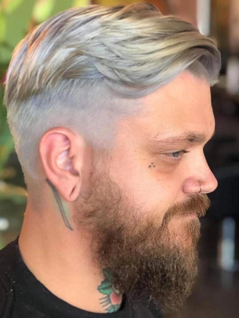 Man with silvery blonde hair with shaved sides