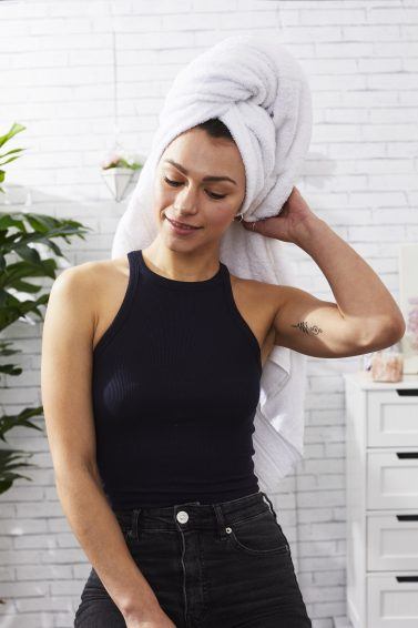 Woman out of the shower with towel on her head