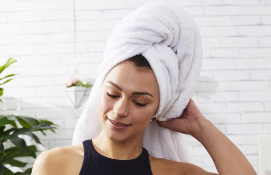 Woman out of the shower with towel on her head
