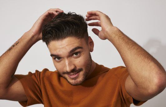 Man with short swept back messy quiff