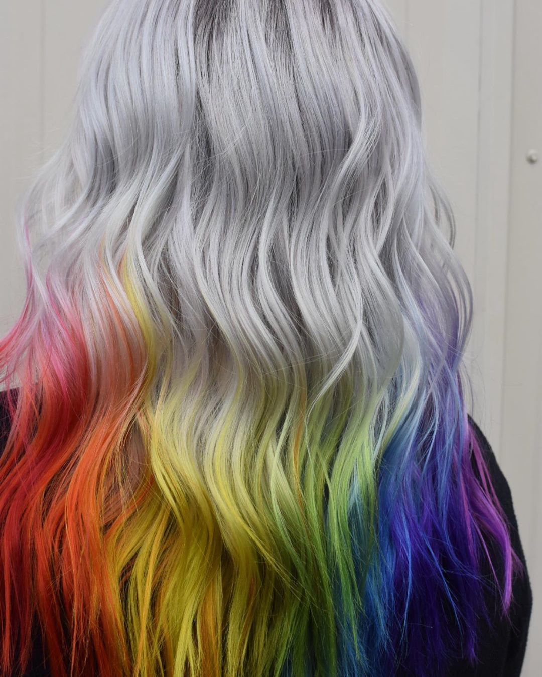 Woman with icy silver hair with rainbow tips