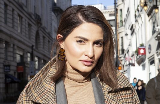 Street style shot of a woman with a brunette bob