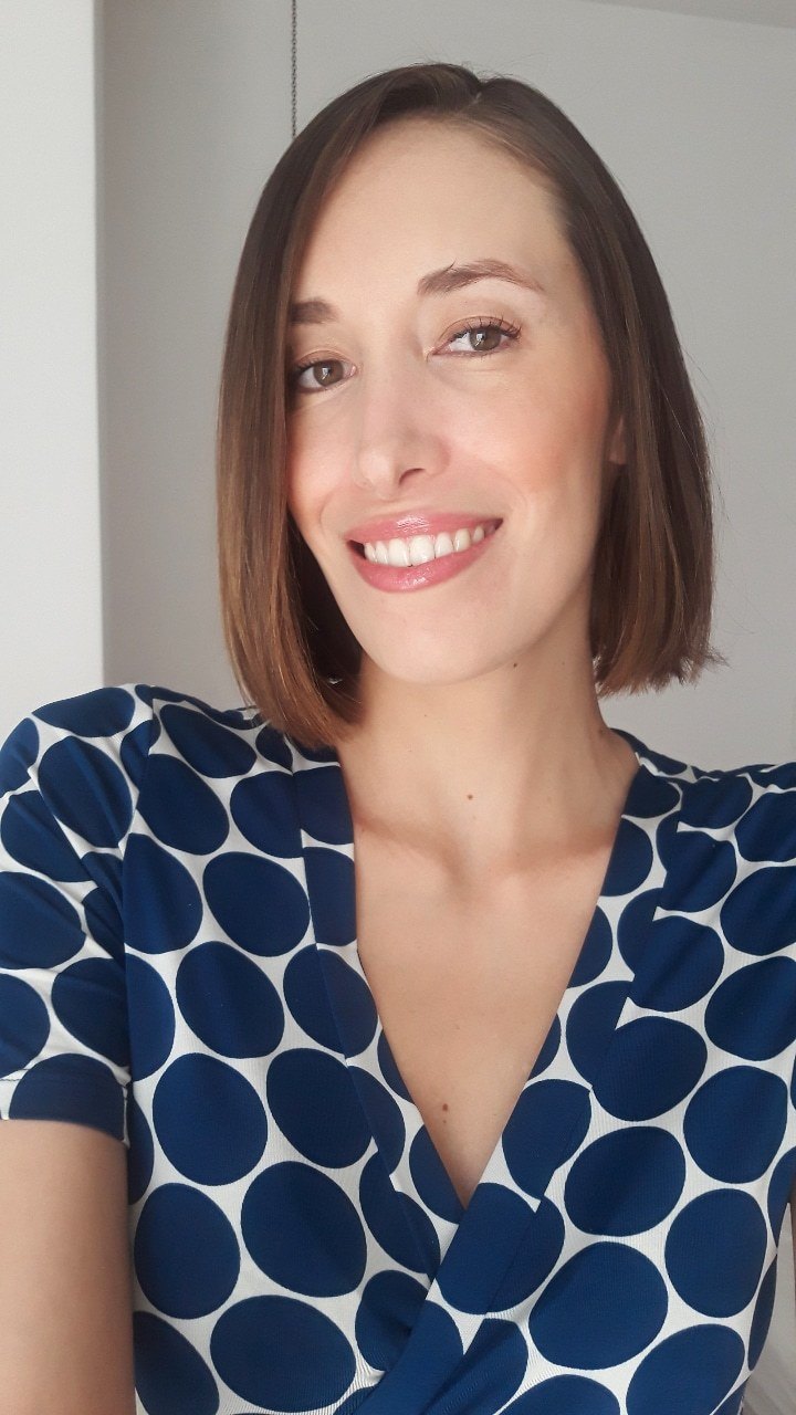 woman with short straight brown hair in a bob style