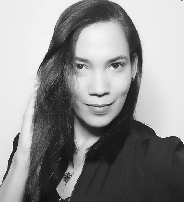 black and white image of a woman with straight medium length hair