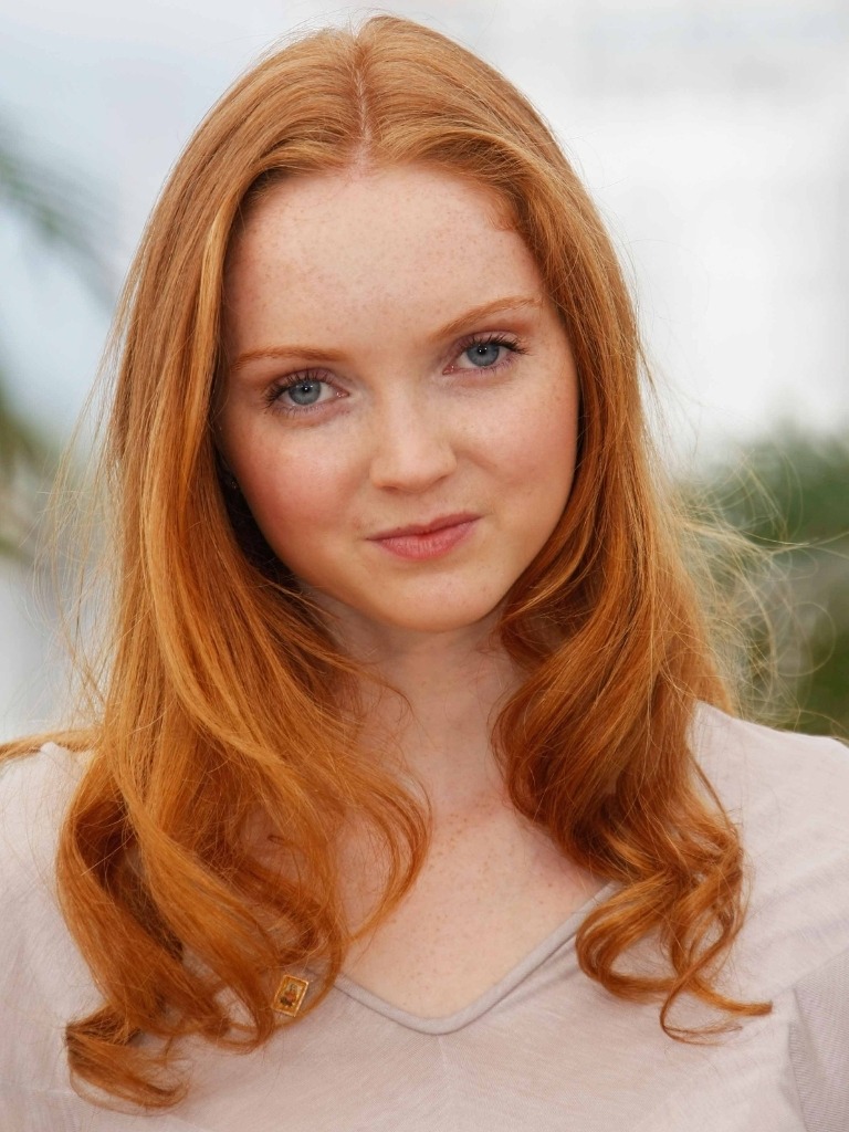 Famous redheads: Lily Cole with long natural ginger hair with tumbling curls.