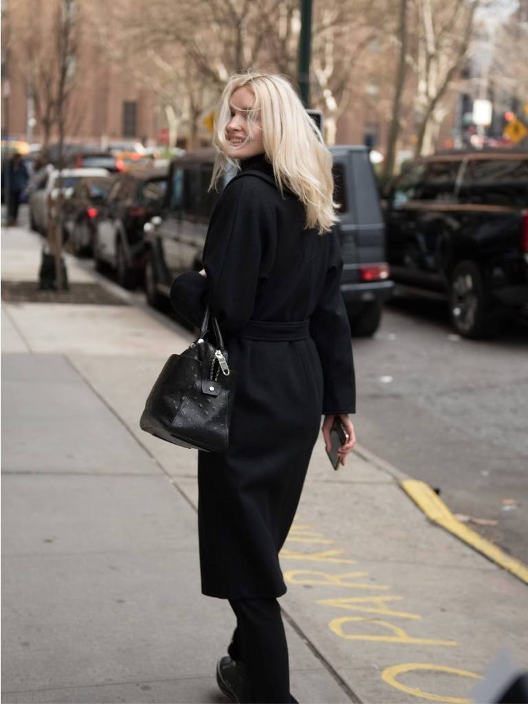 Woman with long windswept bleach blonde hair