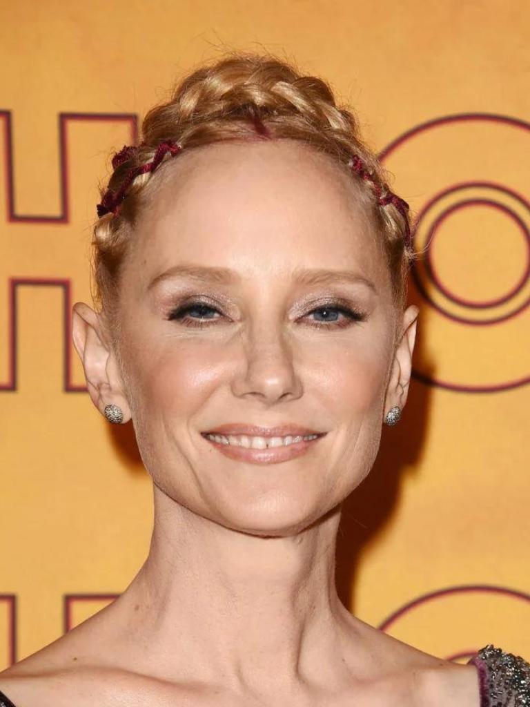 image of Anne Heche smiling with strawberry blonde braids