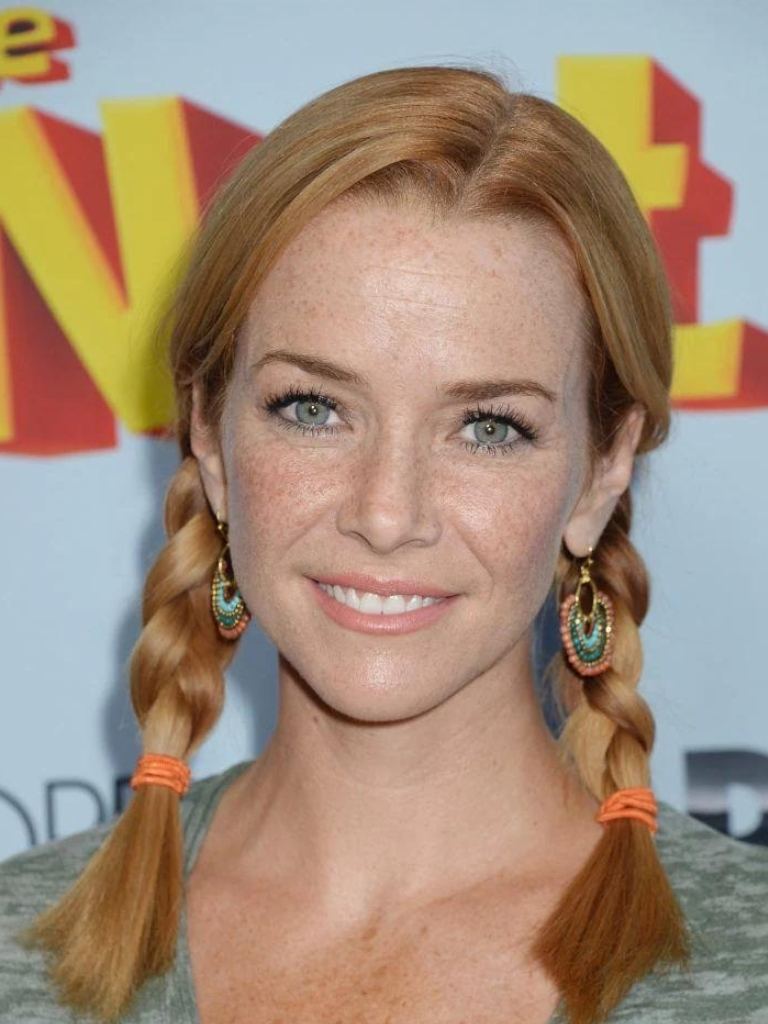 front facing image of Annie Wersching with strawberry blonde hair in two braids