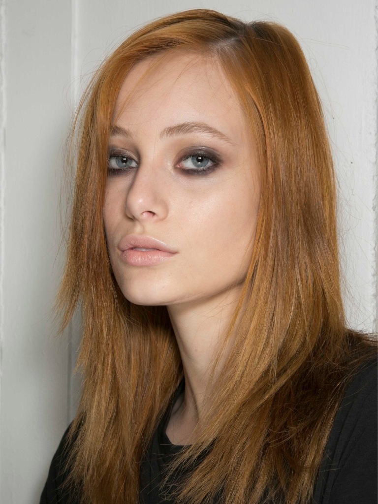 Model with mid length straight strawberry blonde hair