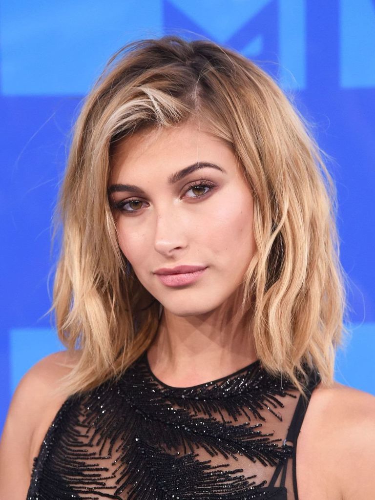 Hailey Baldwin blonde long bob layered 90s hair.