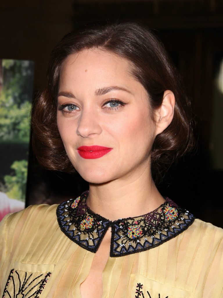 Marion Cotillard with chocolate brown curly retro bob.
