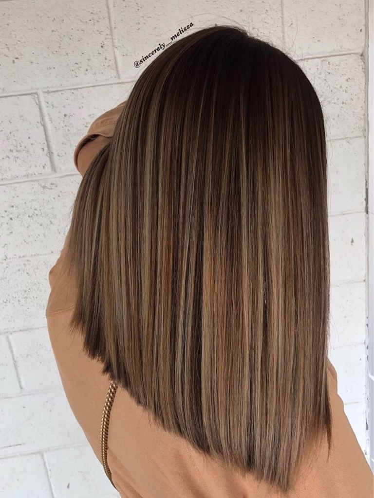 Cinnamon-inspired brunette balayage on medium length dark brown hair