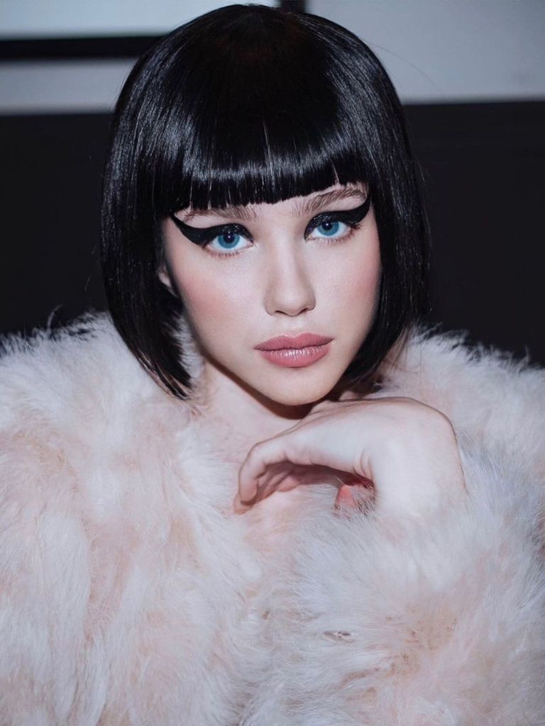 Woman with black Pulp Fiction inspired French bob.