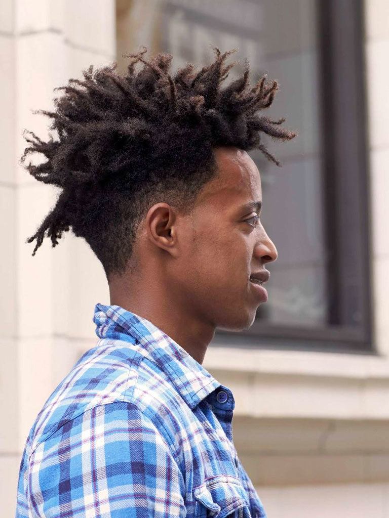 black man with a frohawk hairstyle and dreadlocks. From Instagram