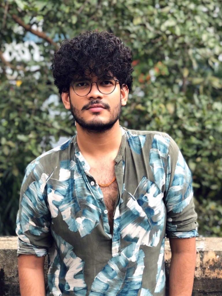 Man with curly fringe on dark hair