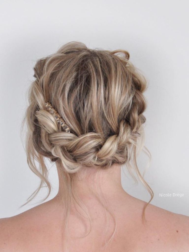 Woman with blonde hair and braided up do