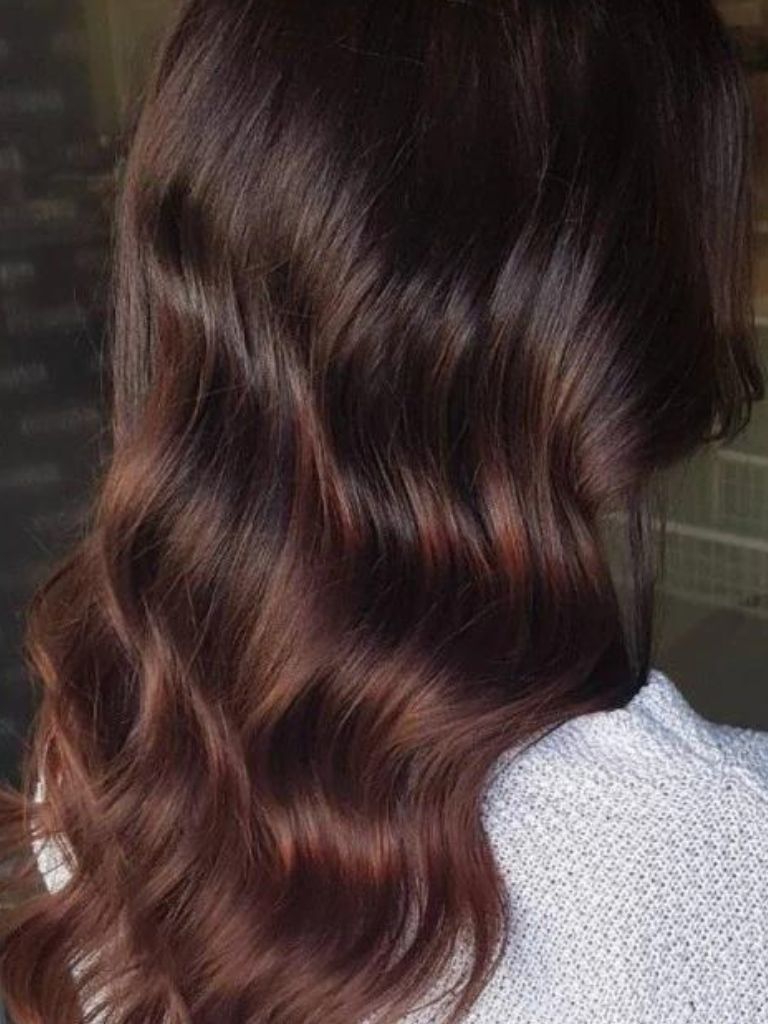 Woman with mahogany balayage hair