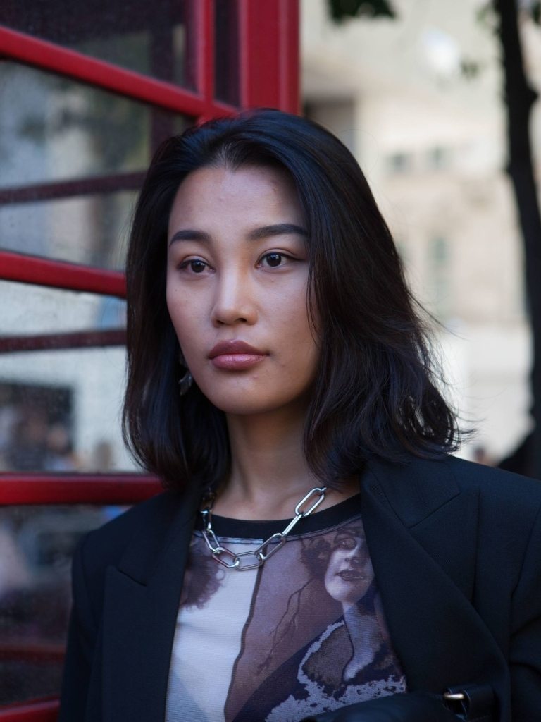Woman with textured short Asian long bob haircut