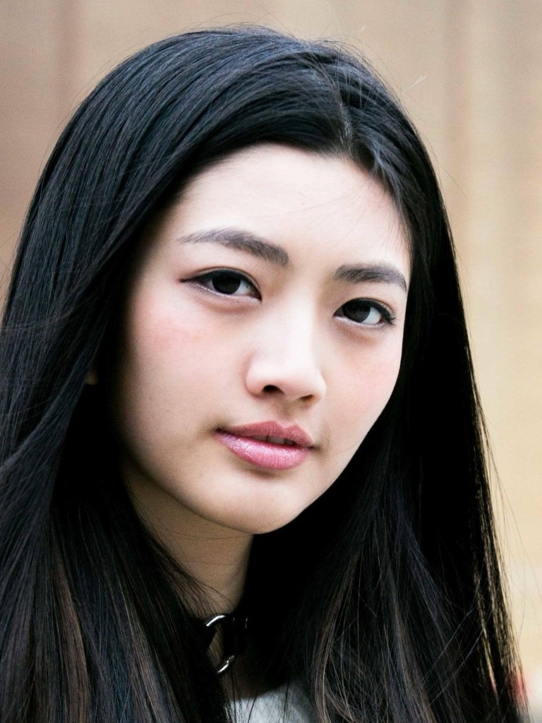Asian hairstyles: Asian model with dark brown straight thick hair.