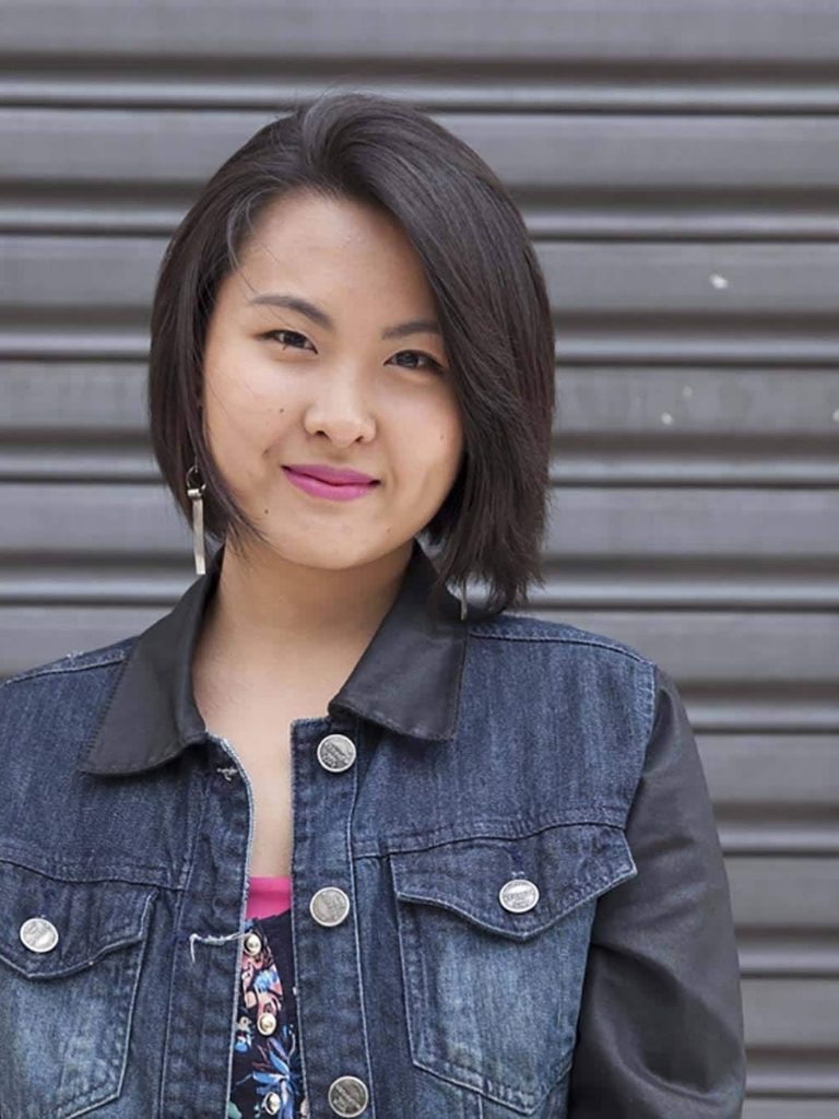 Asian hairstyles; Asian woman with dark brown straight bob with soft layers.