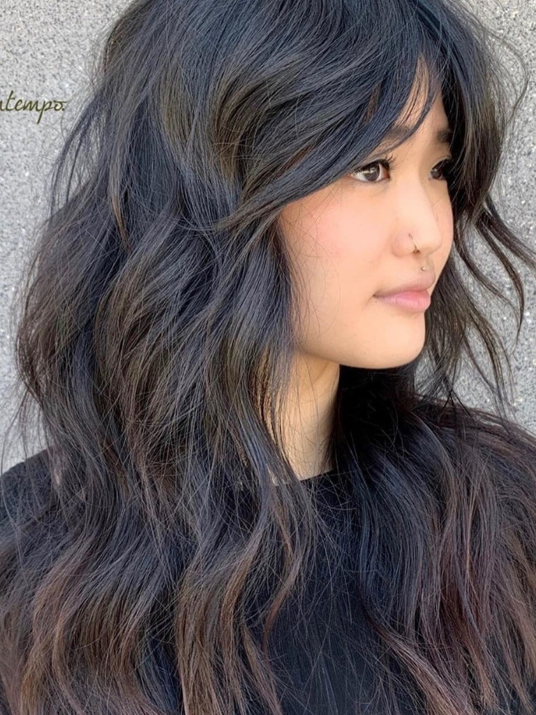 Woman with Asian long shag haircut