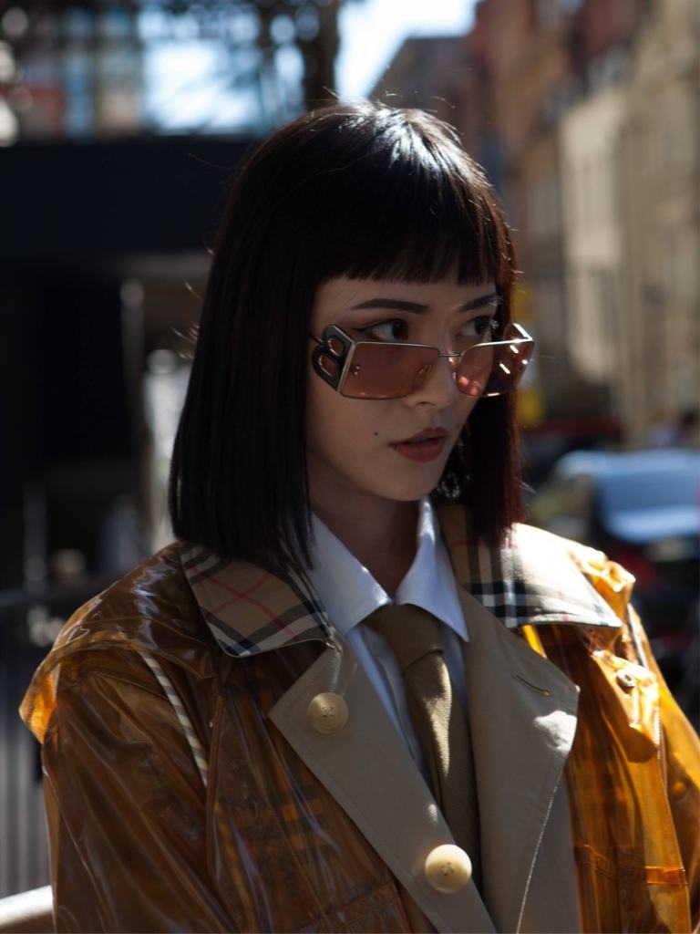 Asian woman with straight hair with straight bangs