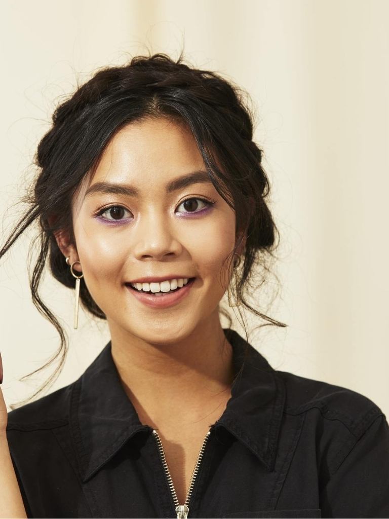 Woman with Asian hair styled into a milkmaid braid