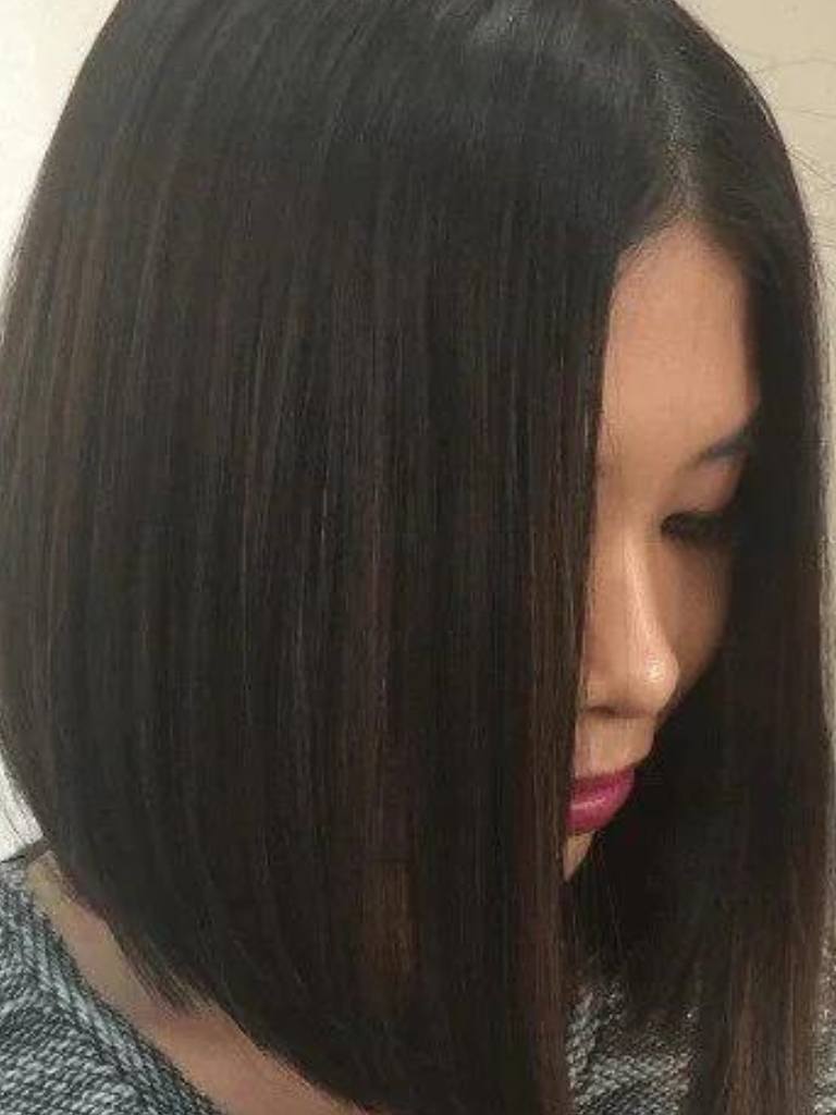 Asian hairstyles: Asian woman with dark brown hair in a graduated long bob.