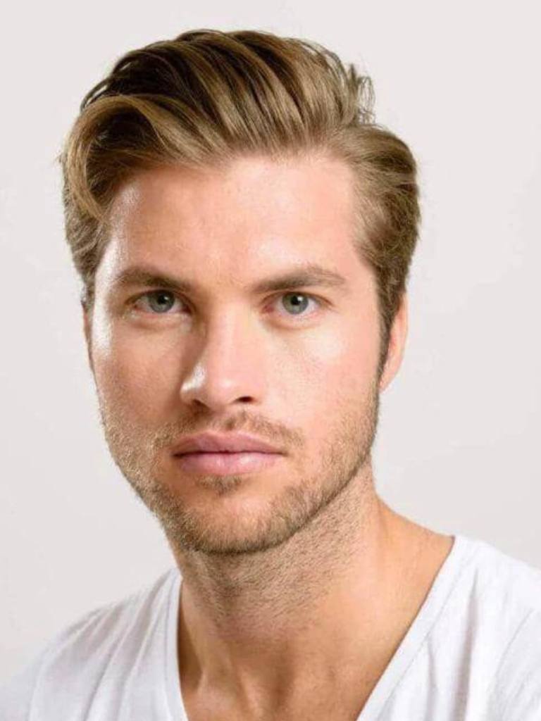 Man with blonde hair swept back comb over