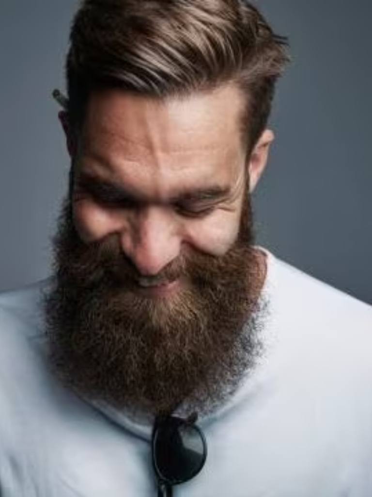 Man with light brown combover and beard