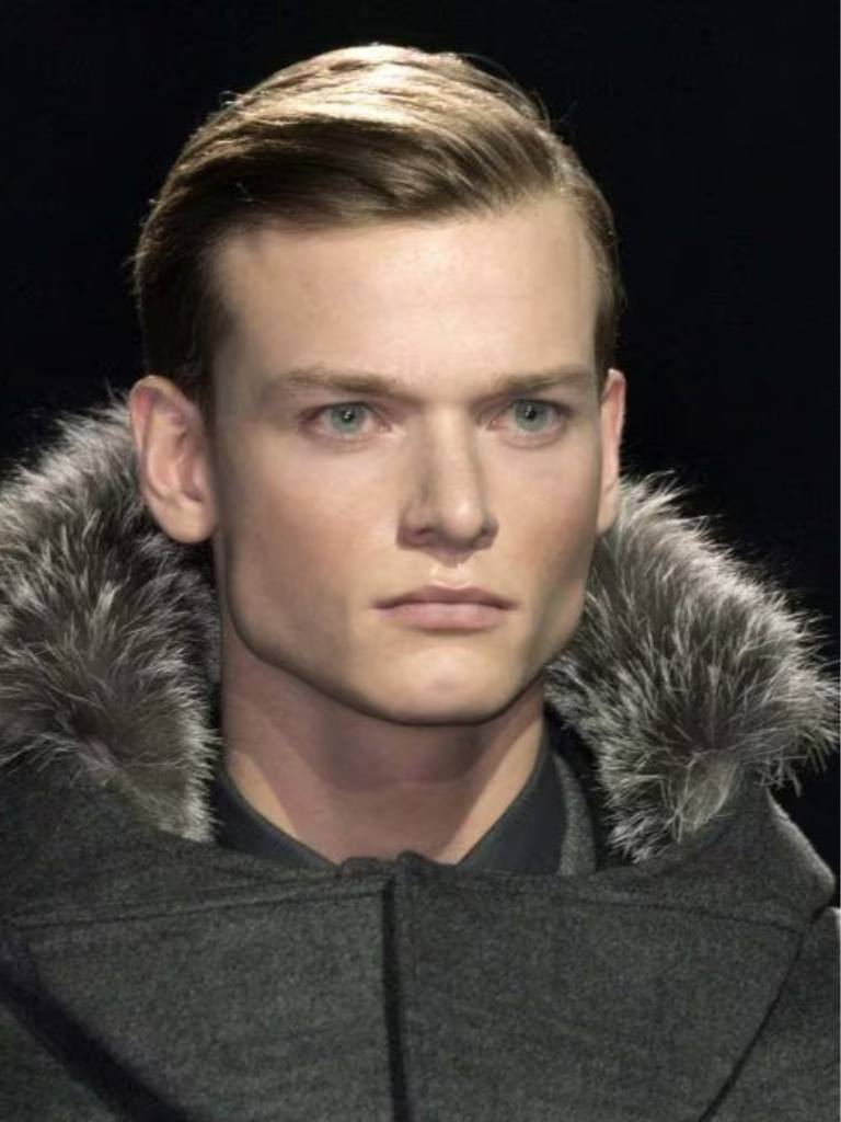 Man with blonde hair styled in a combover