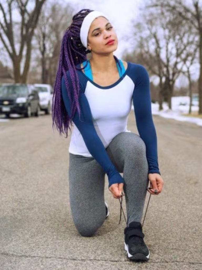 Woman with dark purple medium box braids