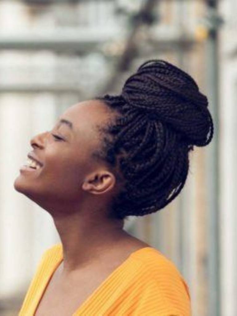 Smiling woman with high bun