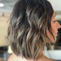 Woman with short hair and brown balayage
