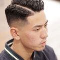 Hairstyles for men with thin hair: Man with shaved sides and quiff hairstyle.