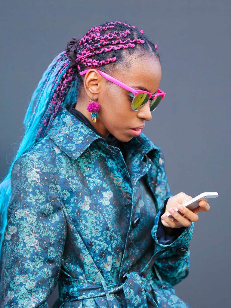 Long box braids hairstyles: Street style photo of a woman with coloured long box braids in a ponytail
